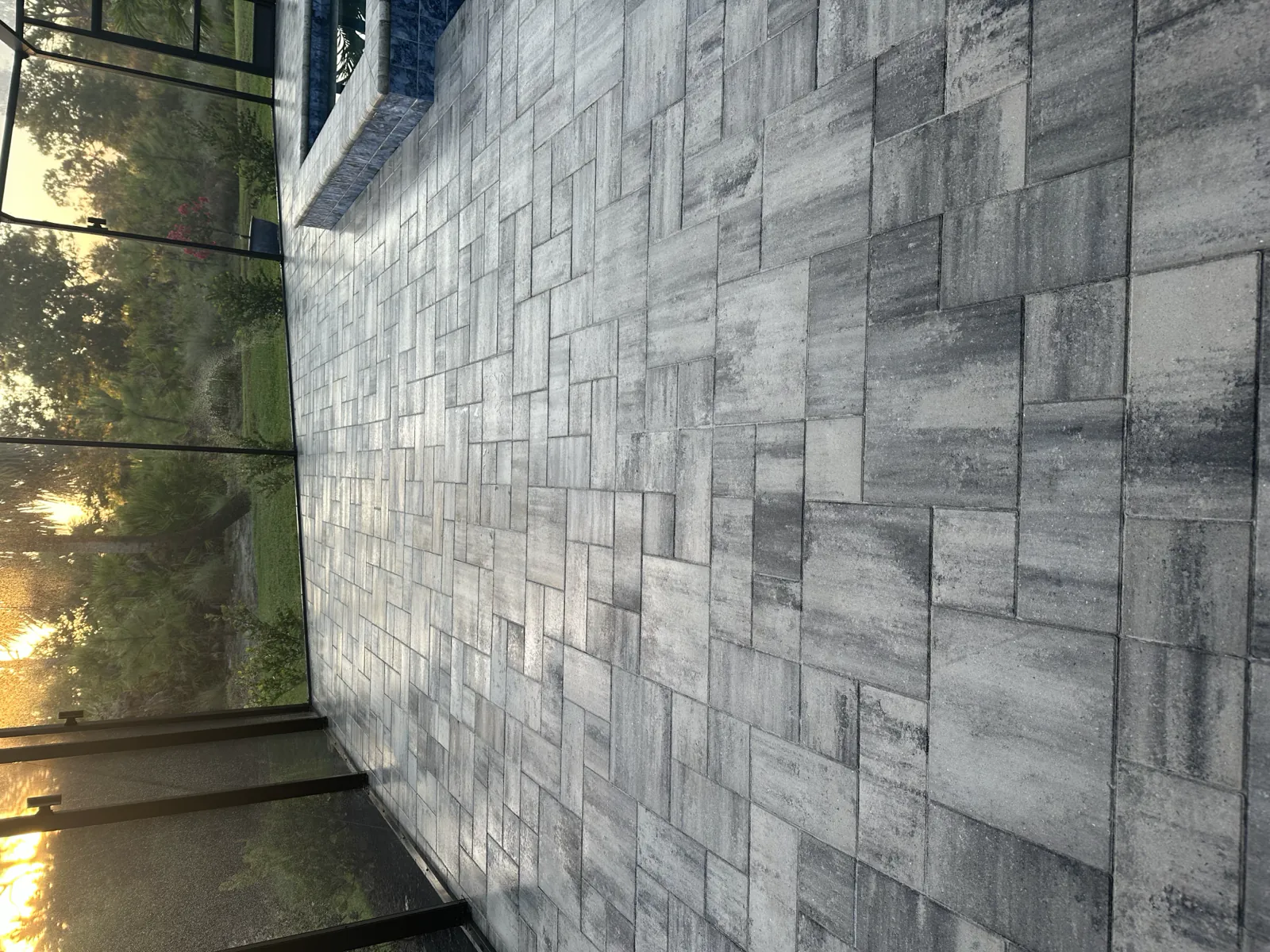 Pool deck pavers sealed, with natural stone feature