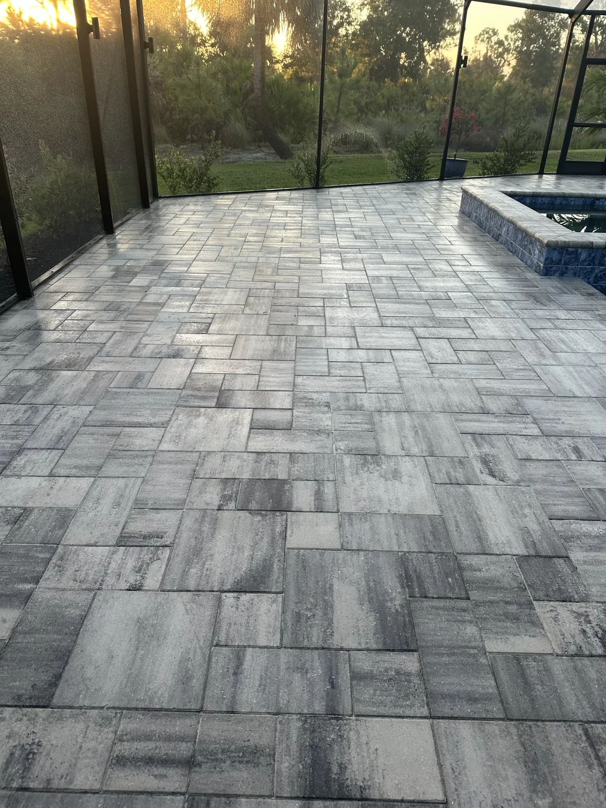 Pool deck pavers sealed, with natural stone feature