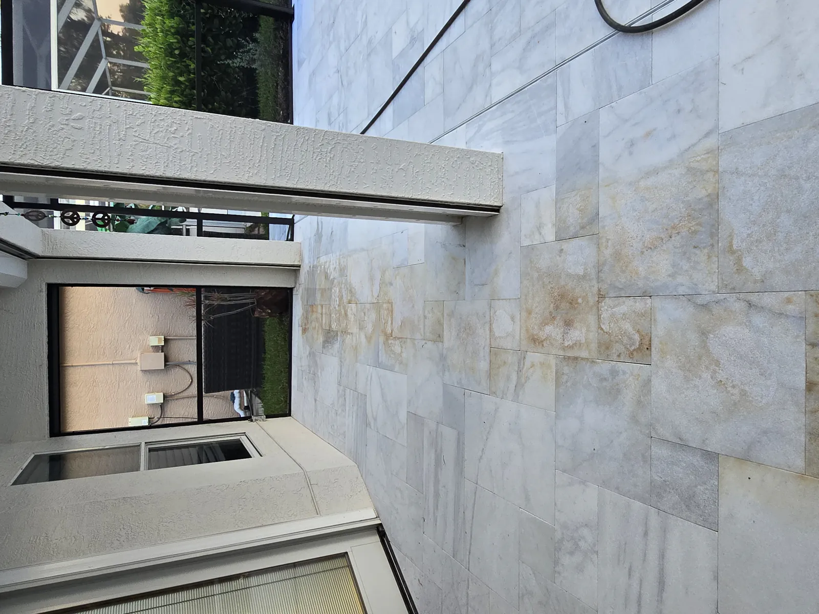 Iron staining on new white marble under the lanai, before treatment
