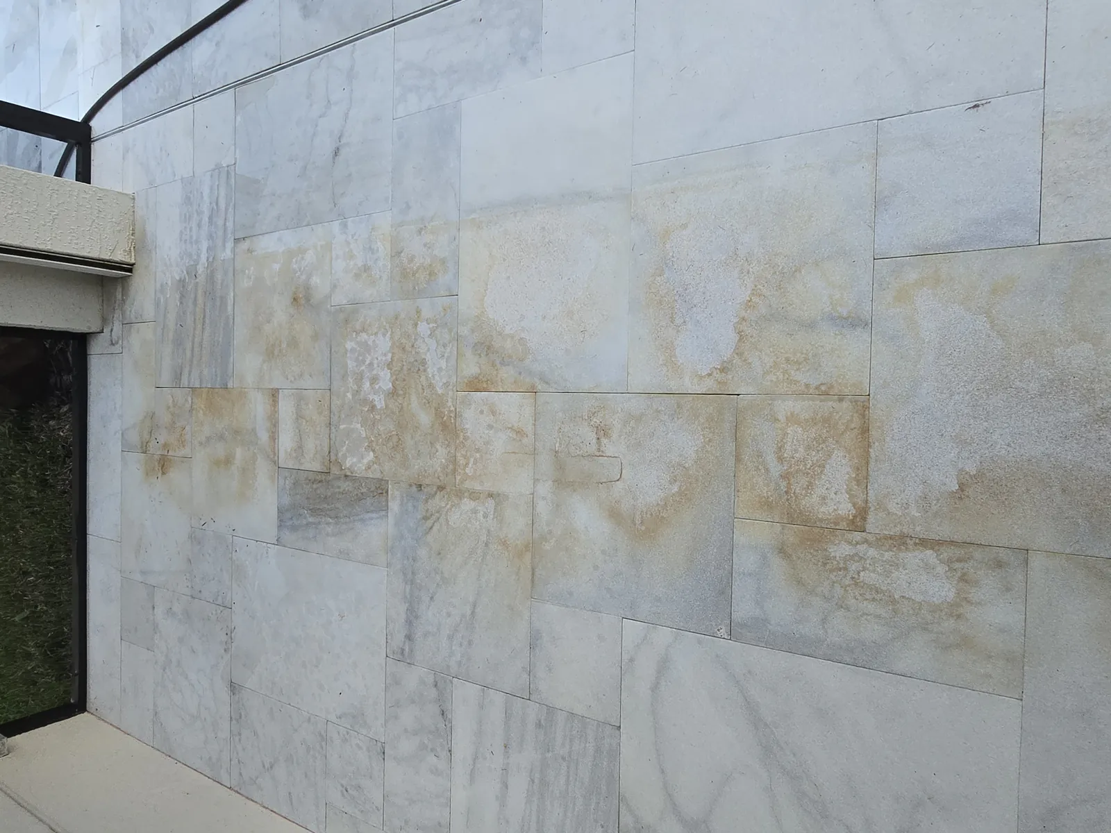 Iron stain pattern on marble near the sliding glass door