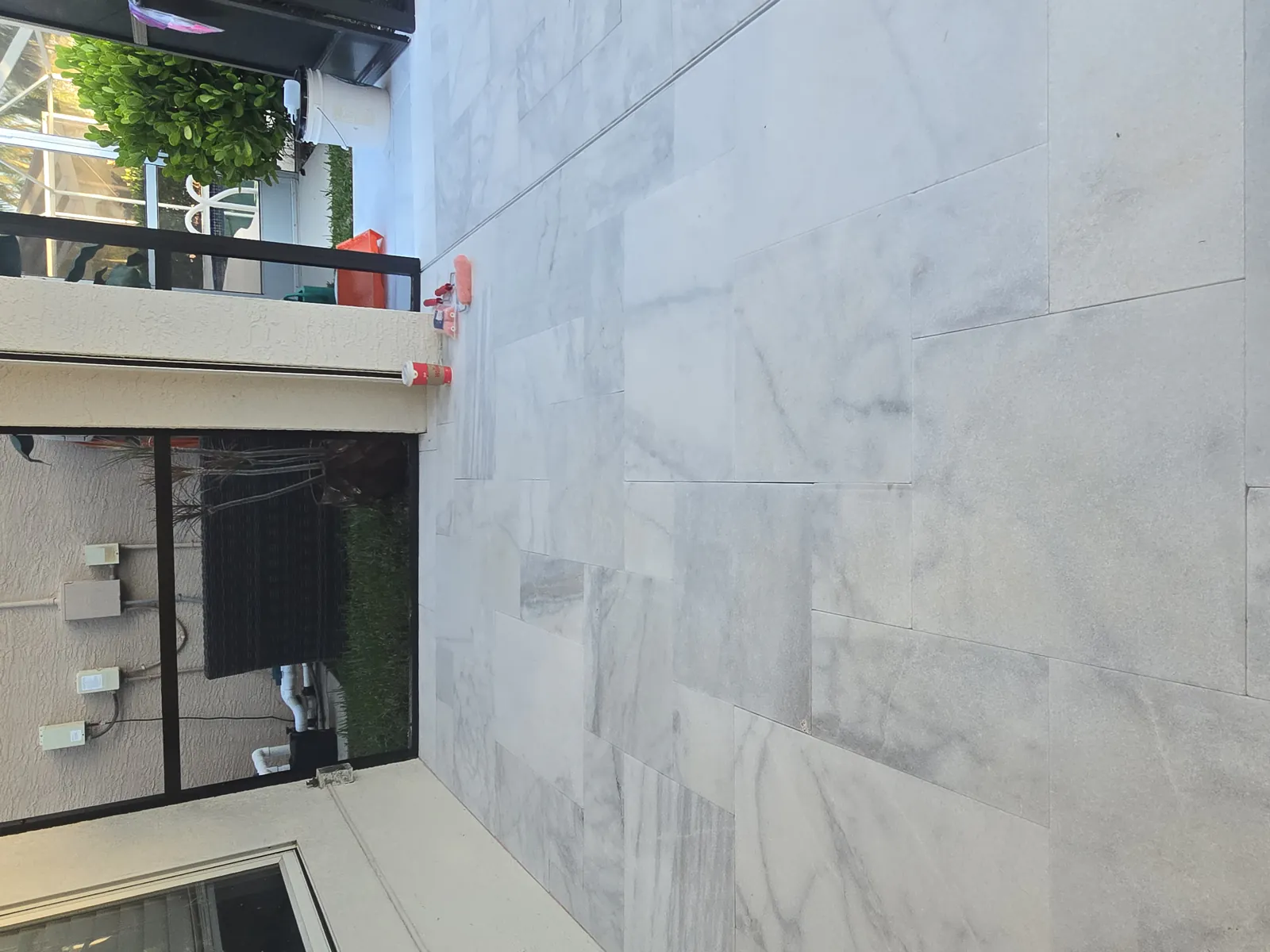 Sealed white marble around the pool, stains gone