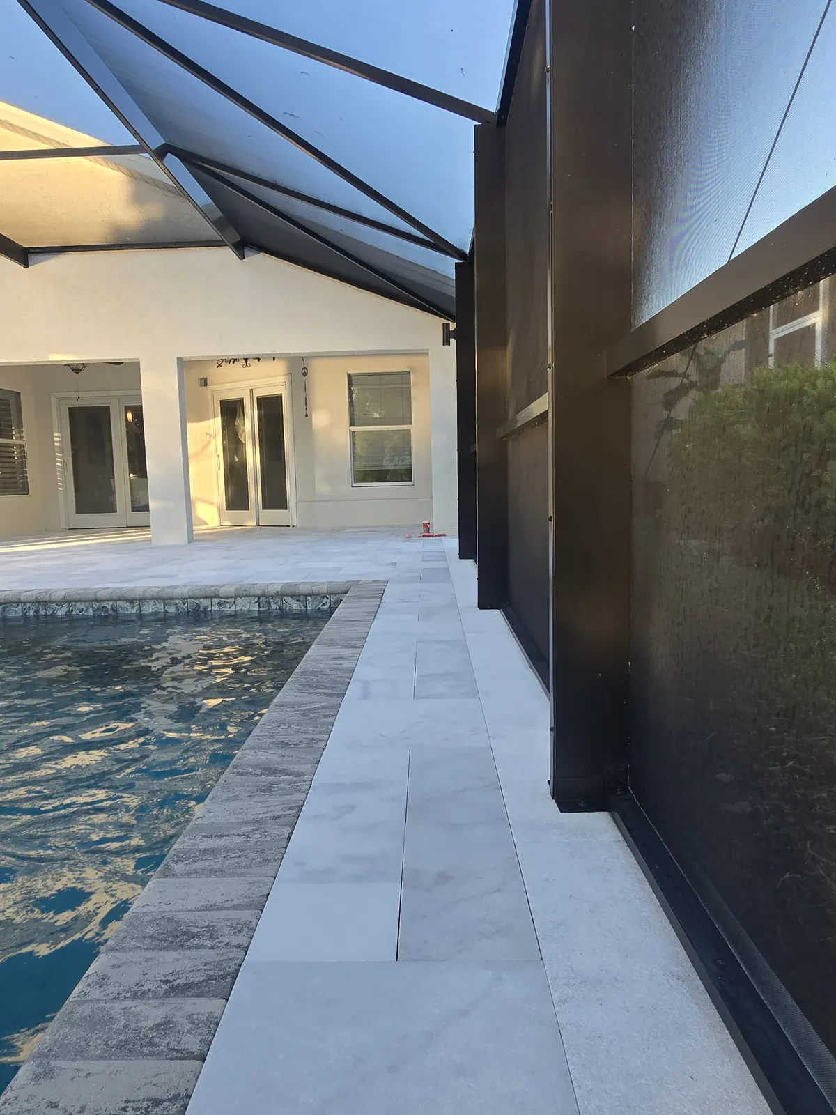 White marble lanai in Estero after iron stain removal and sealing