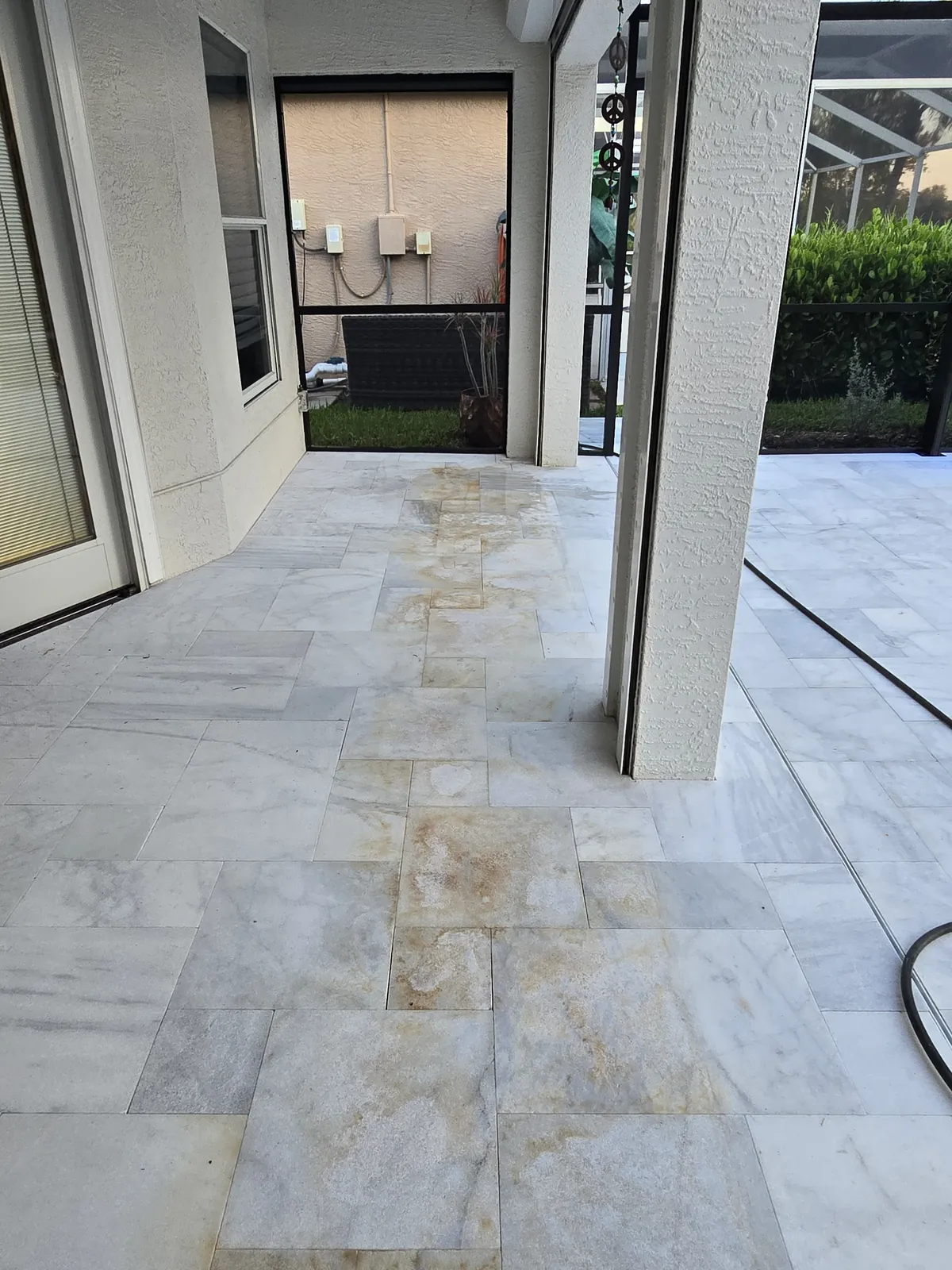 Iron staining on new white marble under the lanai, before treatment
