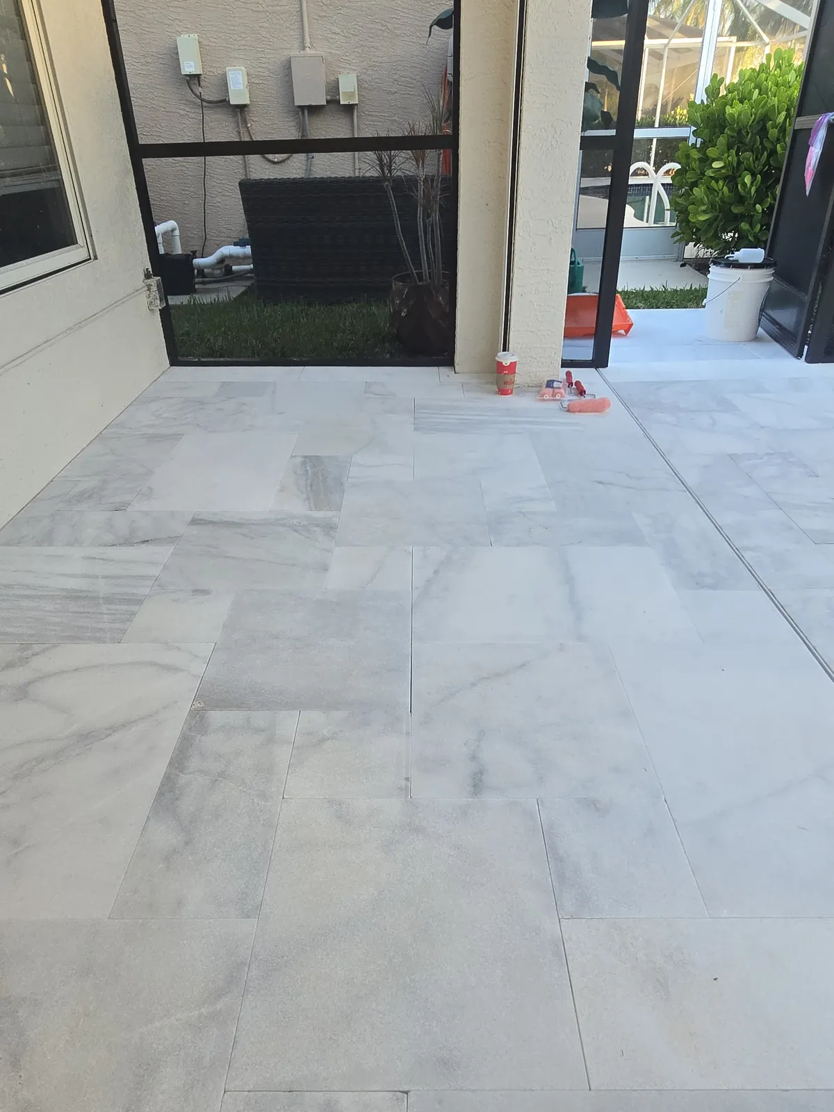 Sealed white marble around the pool, stains gone