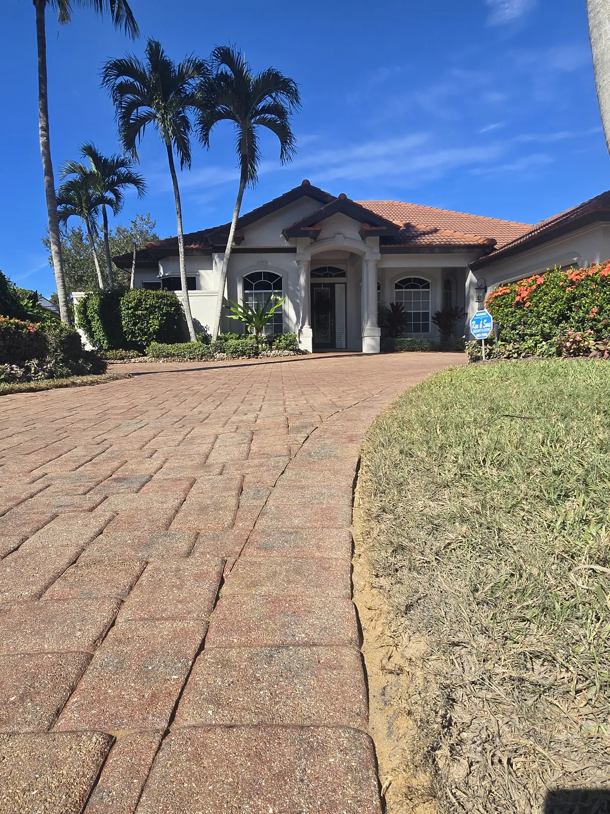 Stripped and resealed paver driveway, uniform finish