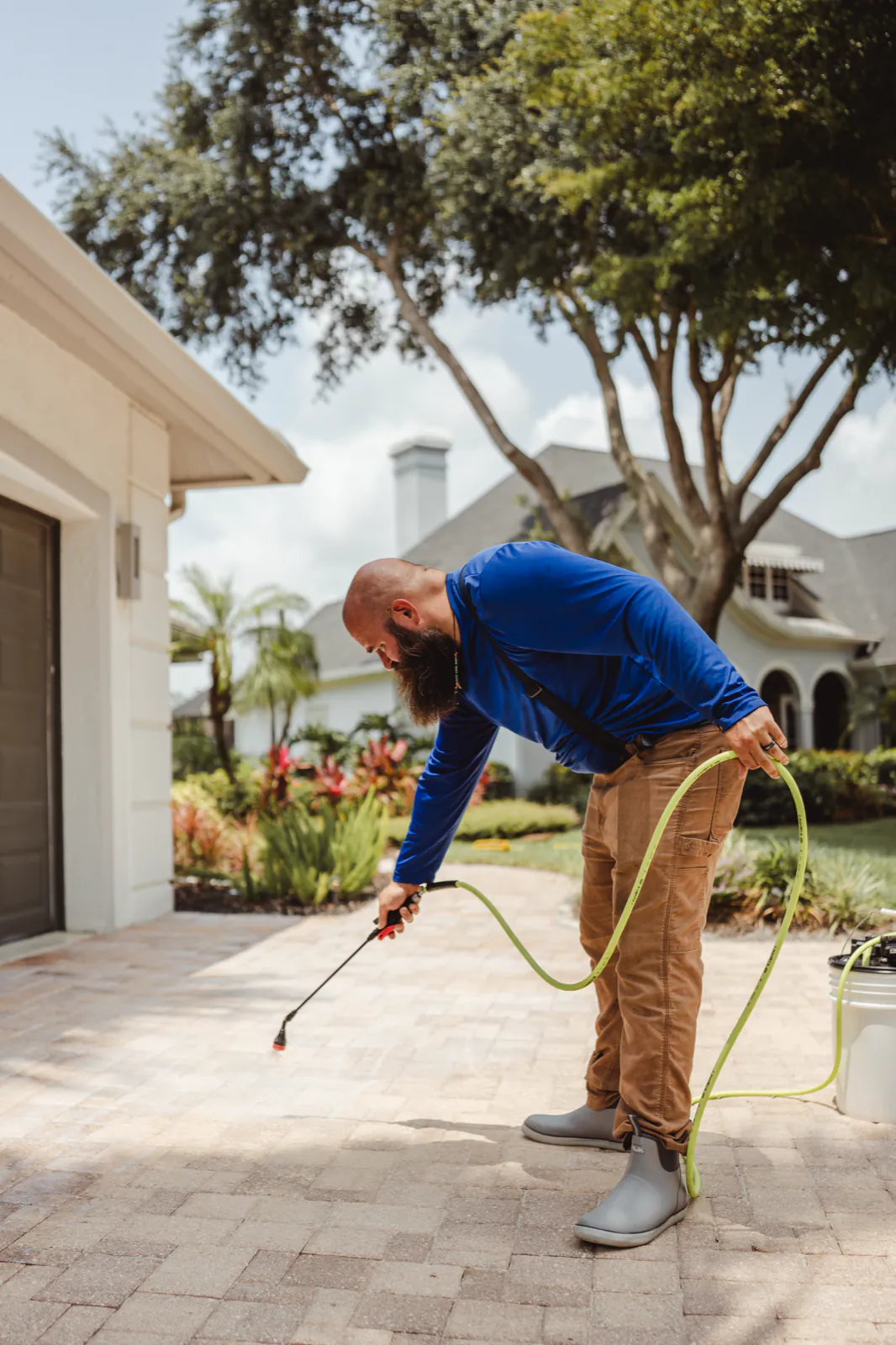 Applying paver sealer with a low-pressure sprayer